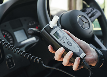 Alcolock breathalyser machine inside a coach